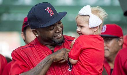 David Ortiz holds a pediatric patient at the 2016 WEEI / NESN Jimmy Fund Radio-Telethon