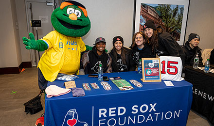 PMC Winter Cycle volunteers with Wally at Fenway Park