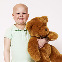 Patient partner Lily with her teddy bear